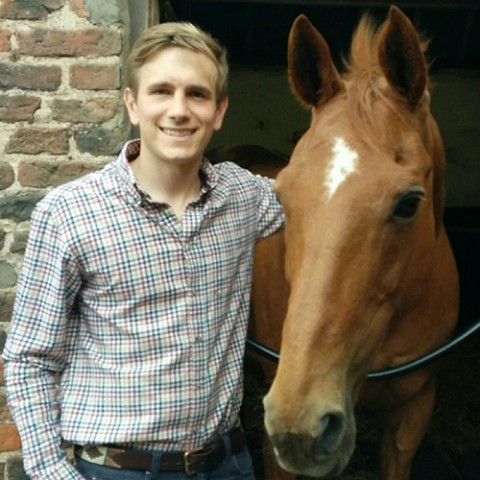 Liam Gamble standing next to a horse
